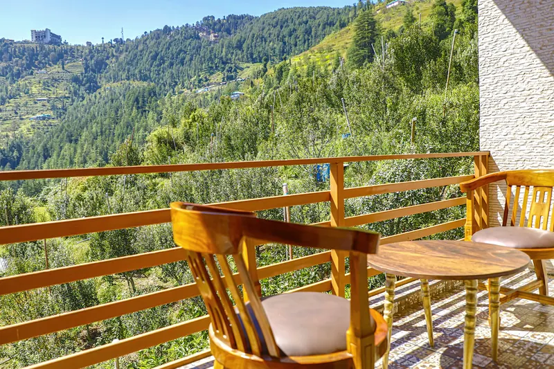 Balcony chairs facing the orchard