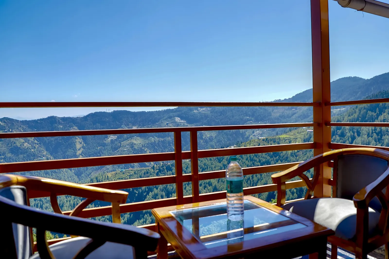 Balcony seating with the Kufri valley beyond the railing