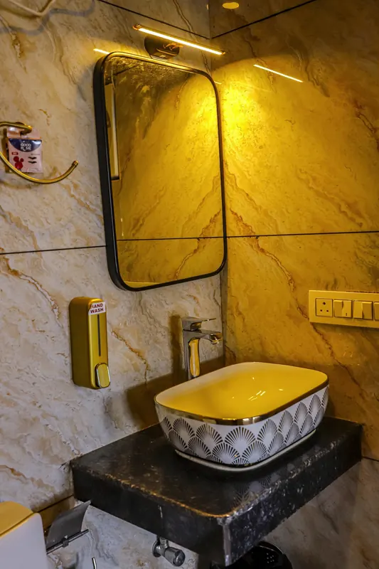 Hand-painted basin on a stone ledge