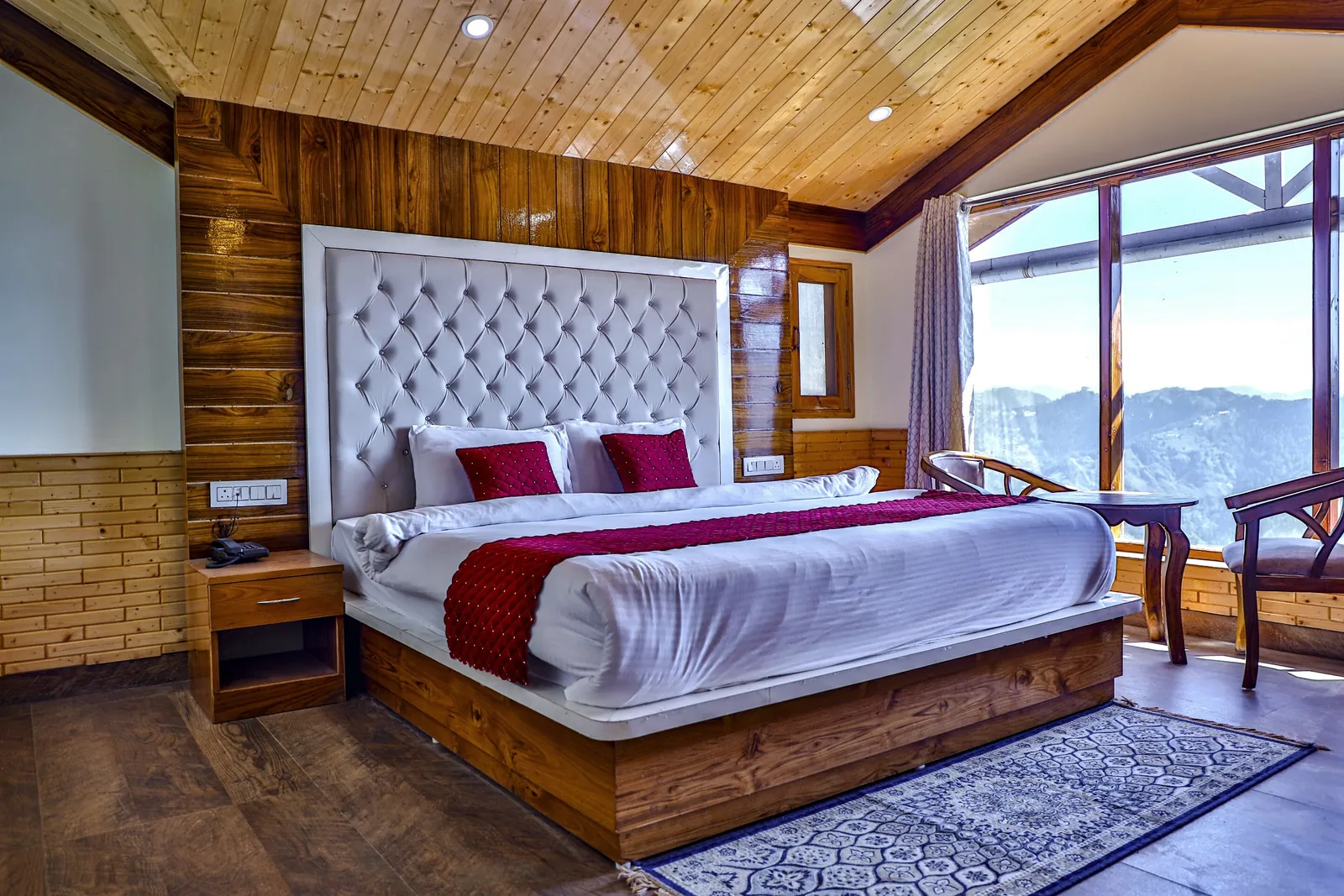 Deluxe Room with pine ceiling and valley-facing window