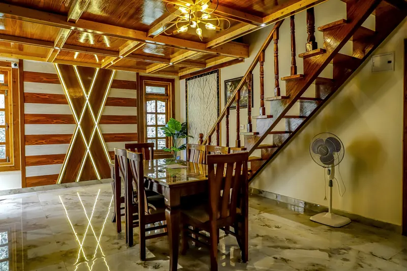 Dining lounge with lit timber panelling