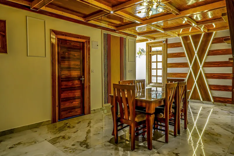 Dining table beneath the coffered ceiling